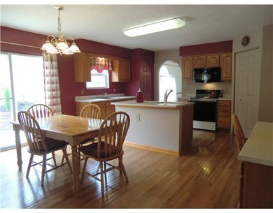 Kitchen. Glistening new hardwood floors welcome yo