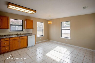 Freshly painted dinning area with view of cabinets