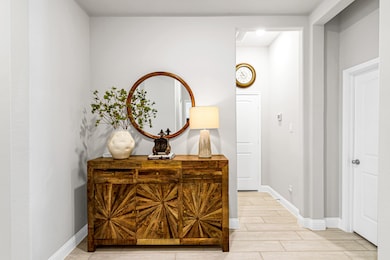 Off the foyer area are doors leading to a secondar