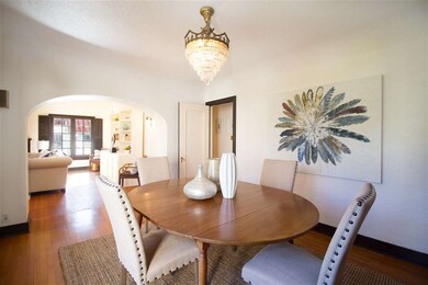Rounded arch between living room and dining room.