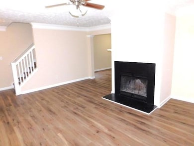Unfurnished living room featuring stairs, ceiling 