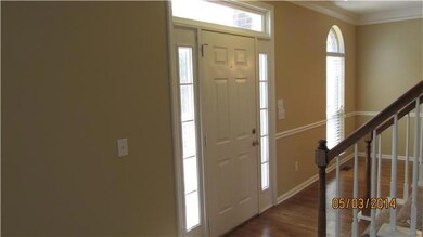 Foyer/Entry open to both Formal Dining area and Living Room with gas fireplace.  The open floor plan gives great flow when entertaining.