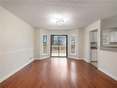 Unfurnished living room with wood-type flooring an