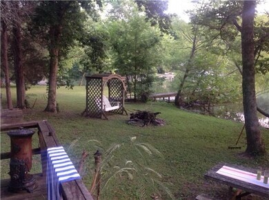 Sitting on 3 lots there is lots of room for picnic tables and swings. Lot goes to the neighboring dock you see in the far right corner of this picture.