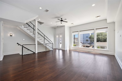 Spacious living area featuring a stunning wall of windows that floods the room with abundant natural light.