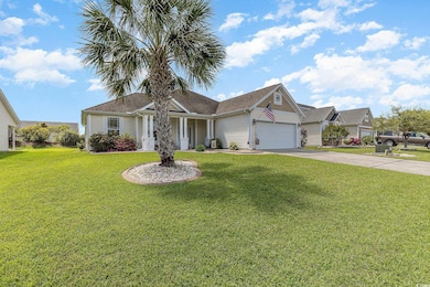 Single story home featuring driveway, an attached 