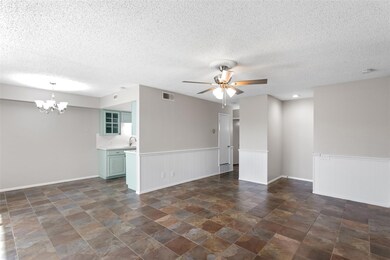 Living room with tile flooring, sink, ceiling fan 