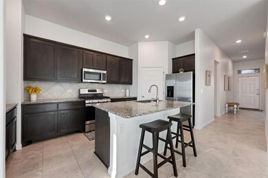 Kitchen featuring appliances with stainless steel