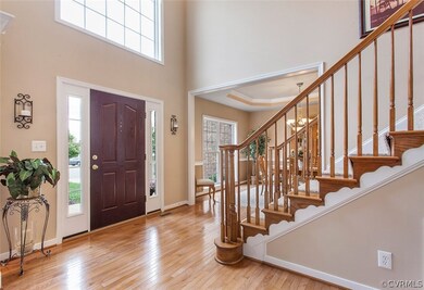 Light-filled, grand foyer welcomes you inside.