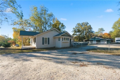 View of front of house featuring a patio and driveway