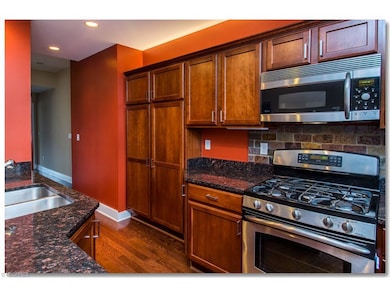 Upgraded Kitchen with Granite Counters, Breakfast Bar, Hardwood Floors and All Stainless Steel               Appliances