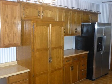Lots of kitchen cabinets with nice pantry