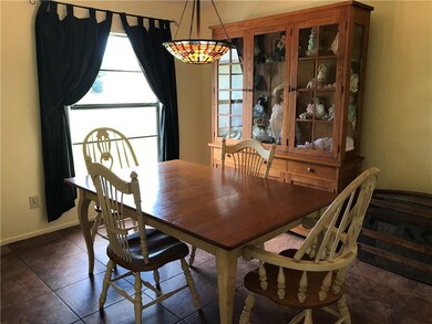 Formal dining area. Colossal picture window for th