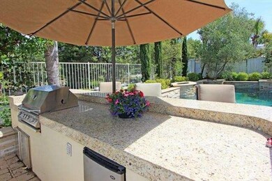 Granite bar with BBQ and refrigerator