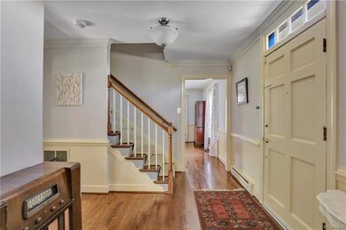 Entrance foyer with transom window over front door