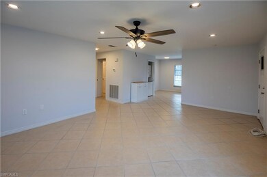 Unfurnished living room featuring a ceiling fan, recessed lighting, and light tile patterned floors