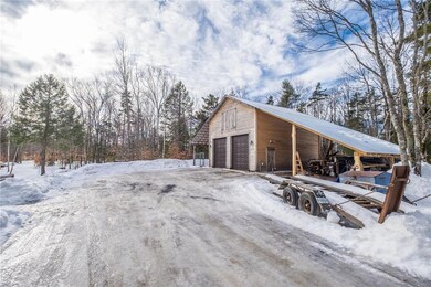 Detached two-car garage with carport