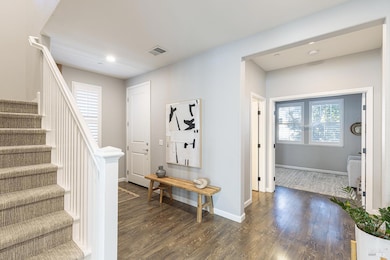 office/den off entry way with half bath