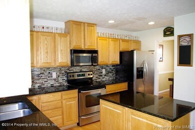 Kitchen w/Tile Backsplash and Island