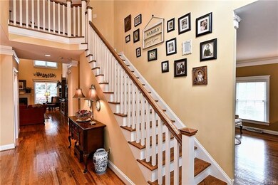 Craftsman style stairs open to upper level hallway