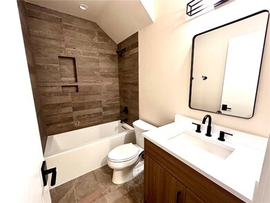 Full bathroom featuring vanity, bathing tub / show