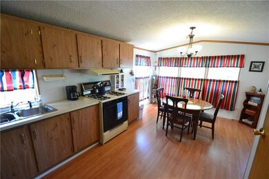 Spacious eat-in kitchen opens to porch.