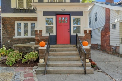 Doorway to property with brick siding