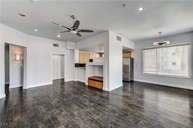 Unfurnished living room featuring ceiling fan, a c