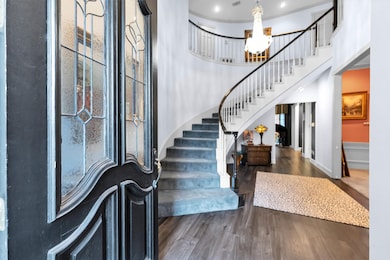 Welcome to your beautiful home complete with crystal chandelier and curved staircase.