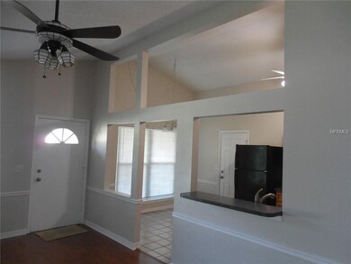 Great room looking into kitchen and casual dining space; breakfast bar; ceiling fans in all rooms