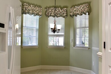 Unfurnished dining area featuring light tile patte