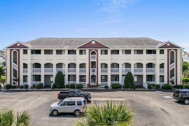 View of property with uncovered parking