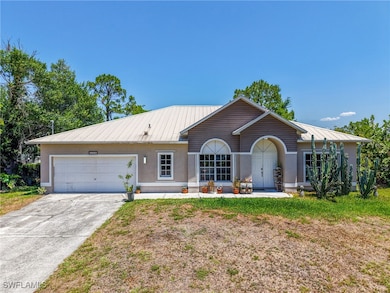 Single story home with stucco siding, an attached