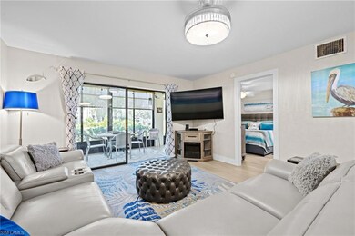 Living room with light wood-type flooring