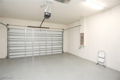 Garage with a garage door opener and electric pane