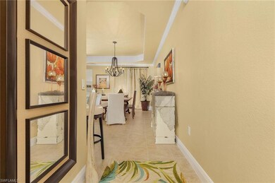 Hall with a notable chandelier, light tile pattern