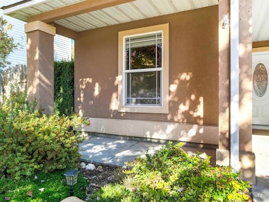 View of exterior entry with stucco siding
