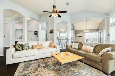 Spacious floor plan with high cathedral ceilings, arches and column accents. Cozy family room open to the kitchen and breakfast room.