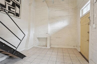 Original mantle is a great focal point in this petit condo