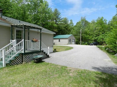 Paved driveway, 1 car garage and...