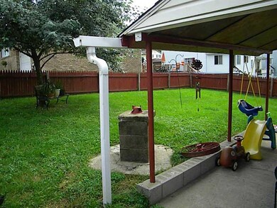 Exterior Back. BACK PORCH LEADS TO FENCED IN YARD