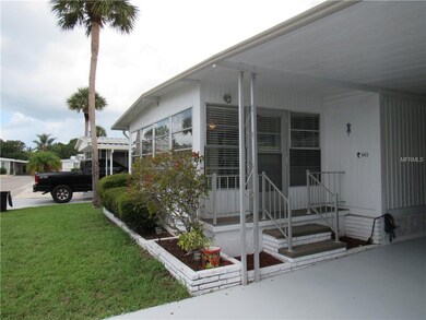 Side entrance to the front enclosed Florida room.
