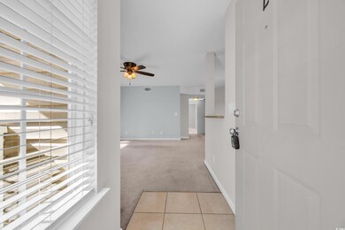 Hall with light colored carpet