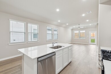 Kitchen in the Elm home plan by Trophy Signature Homes – REPRESENTATIVE PHOTO