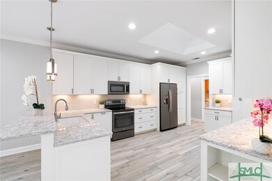 Kitchen w/Stainless Steel Appliances, White Shaker