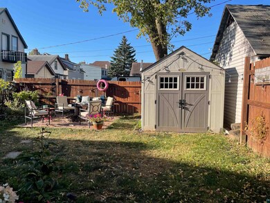 View of outbuilding featuring a yard