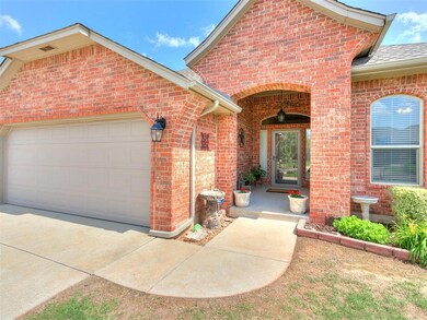 Doorway to property with a garage