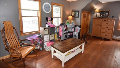 Upstairs family room with hardwood flooring