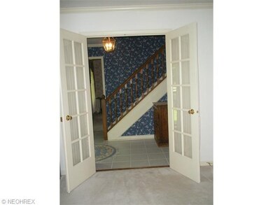 View from living room to foyer and into dining roo