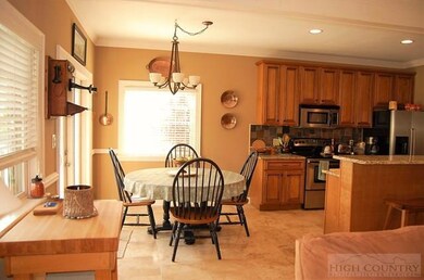 Bright and cheery kitchen with dining room.